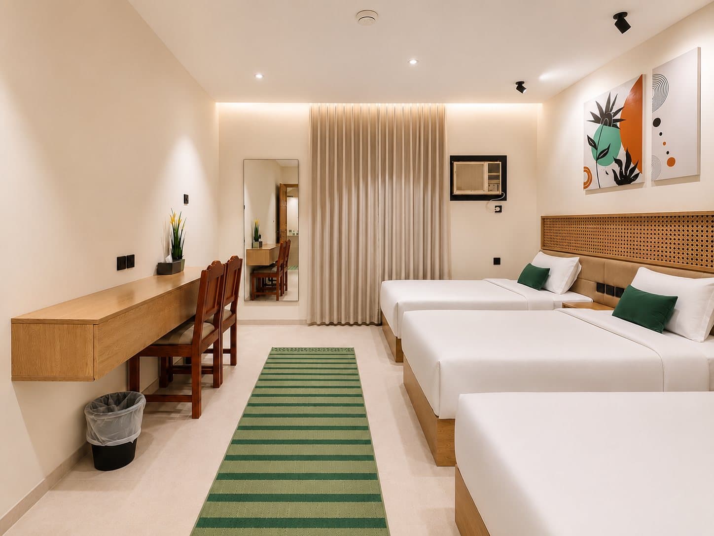 A warm twin-bed room with wood panelling and a green runner — Ibn Khaldun